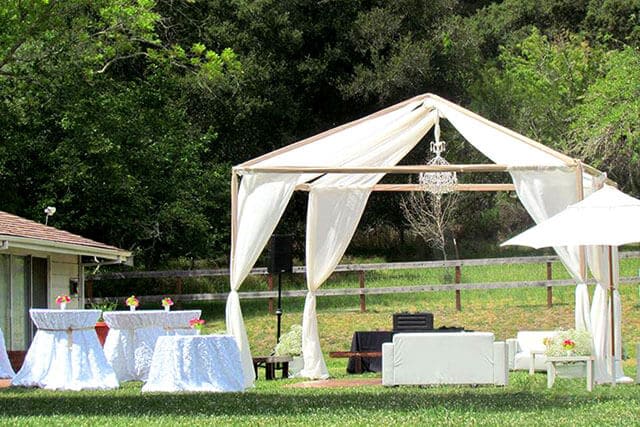 outdoor party table setting under tent