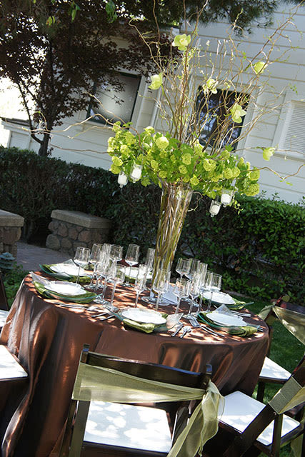 outdoor party table setting with large centerpiece