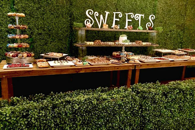 long table buffet of sweets and desserts