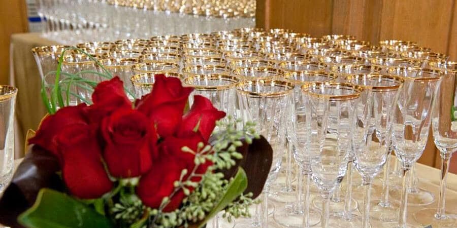 champagne glasses and roses for wedding reception