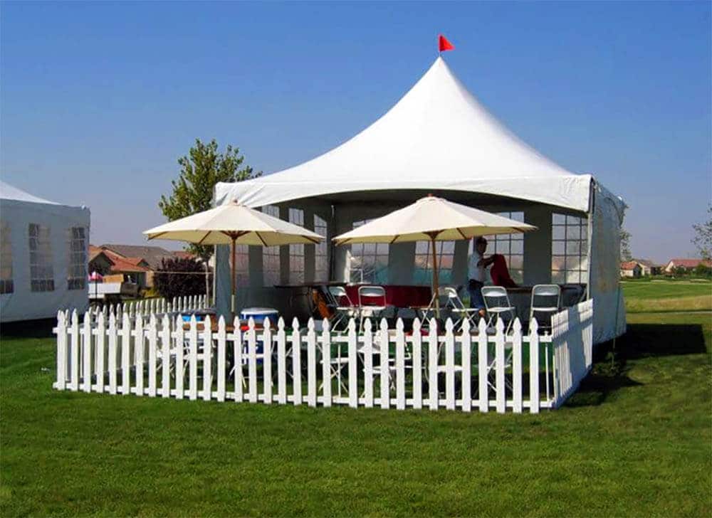 outdoor party tent with white picket fence
