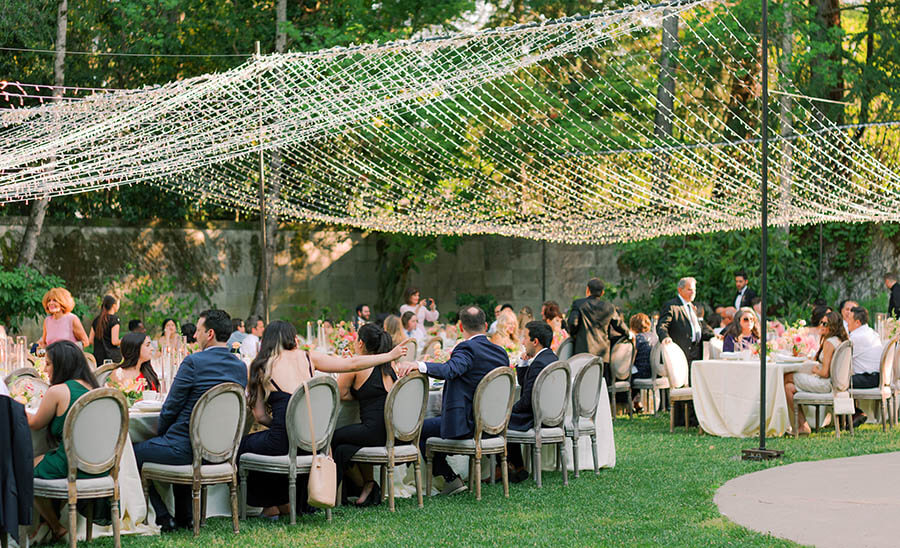 10 party planning tips formal outdoor event daytime with string lighting guests
