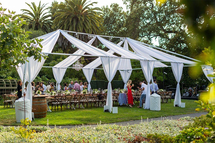 Outdoor Reception with Canopy and Table Settings 10 party planning tip semi-formal outdoor wedding event with guests