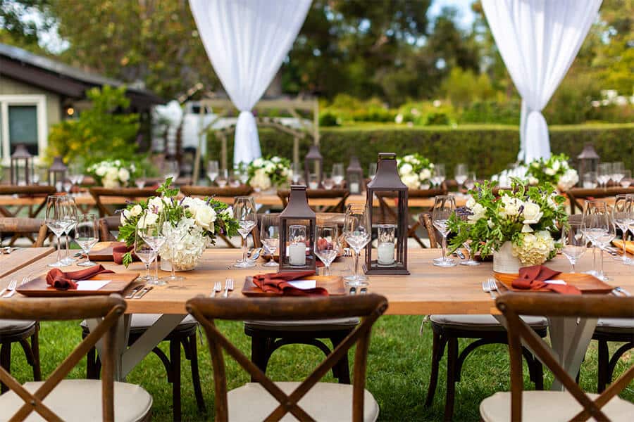 Outdoor Daytime Reception Event with Table Setting and Decorations 10 party planning tips outdoor daytime table setting with decorations