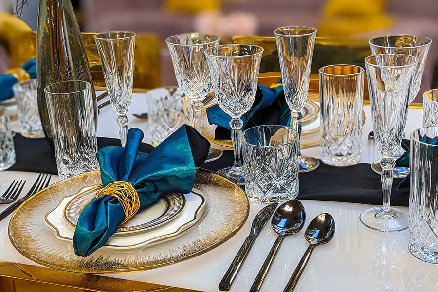 formal table setting with teal blue linen napkins