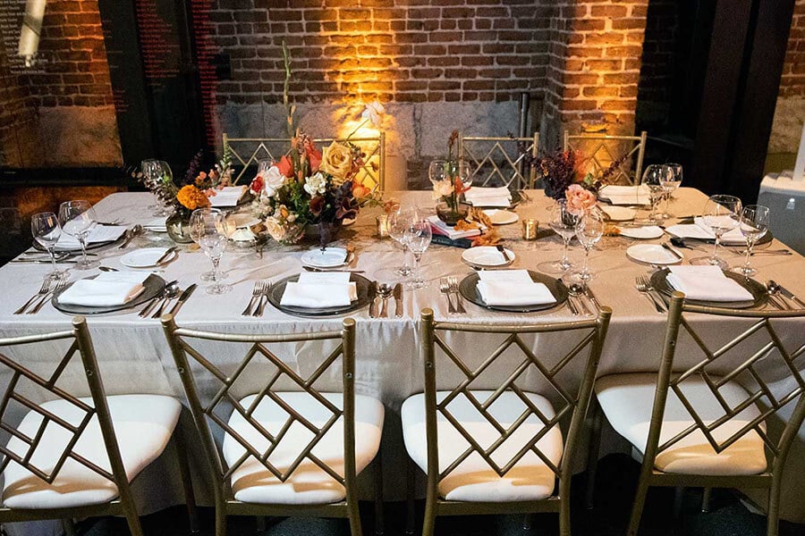 table setting with tablecloth and linen napkins