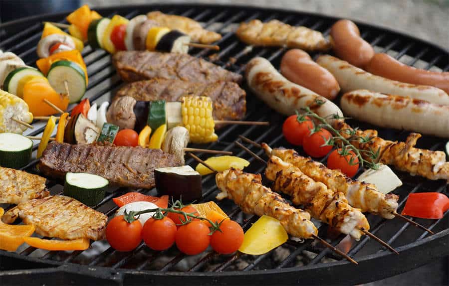 assortment of grilled meats and food cooked on propane bbq grill rental
