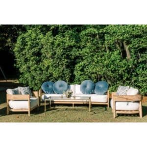 arcadia teak colored white cushioned sofa chairs in outdoor setting