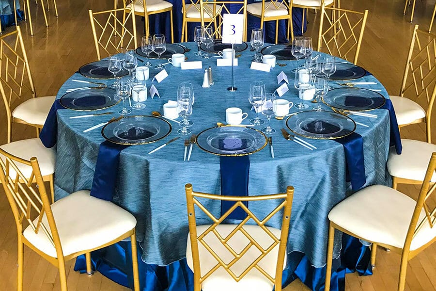 blue tablecloth with matching blue napkins linens for party rentals