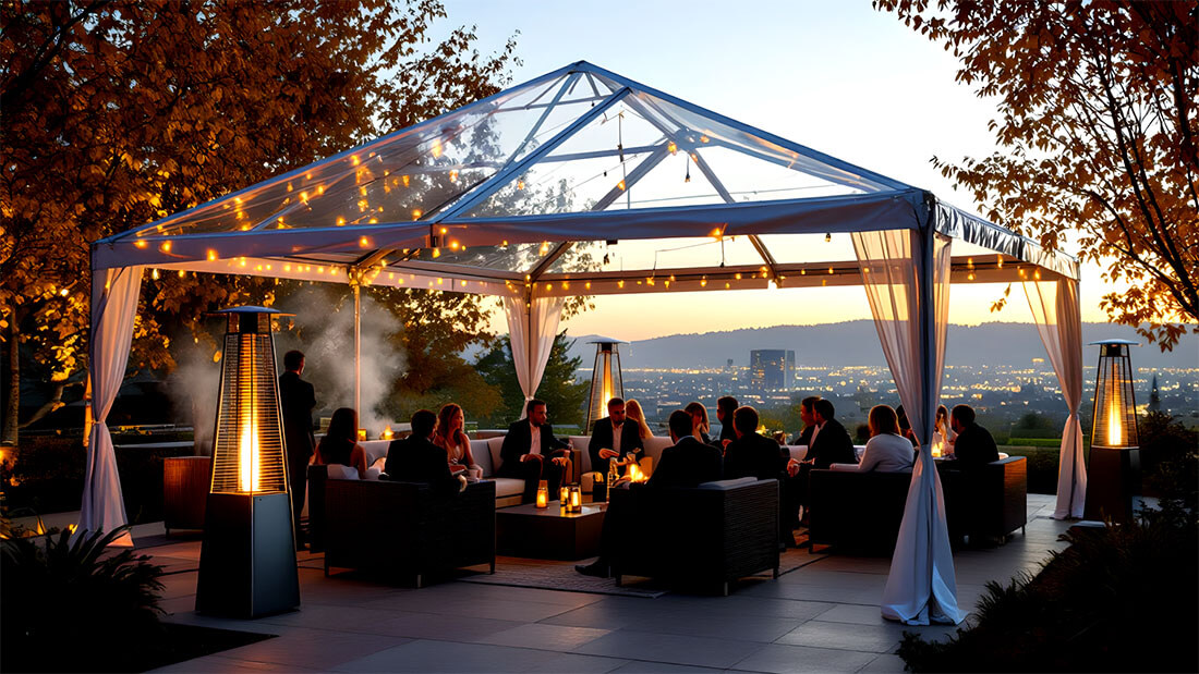 Elegant outdoor evening event under clear-top tent with string lights and heaters in Silicon Valley autumn setting